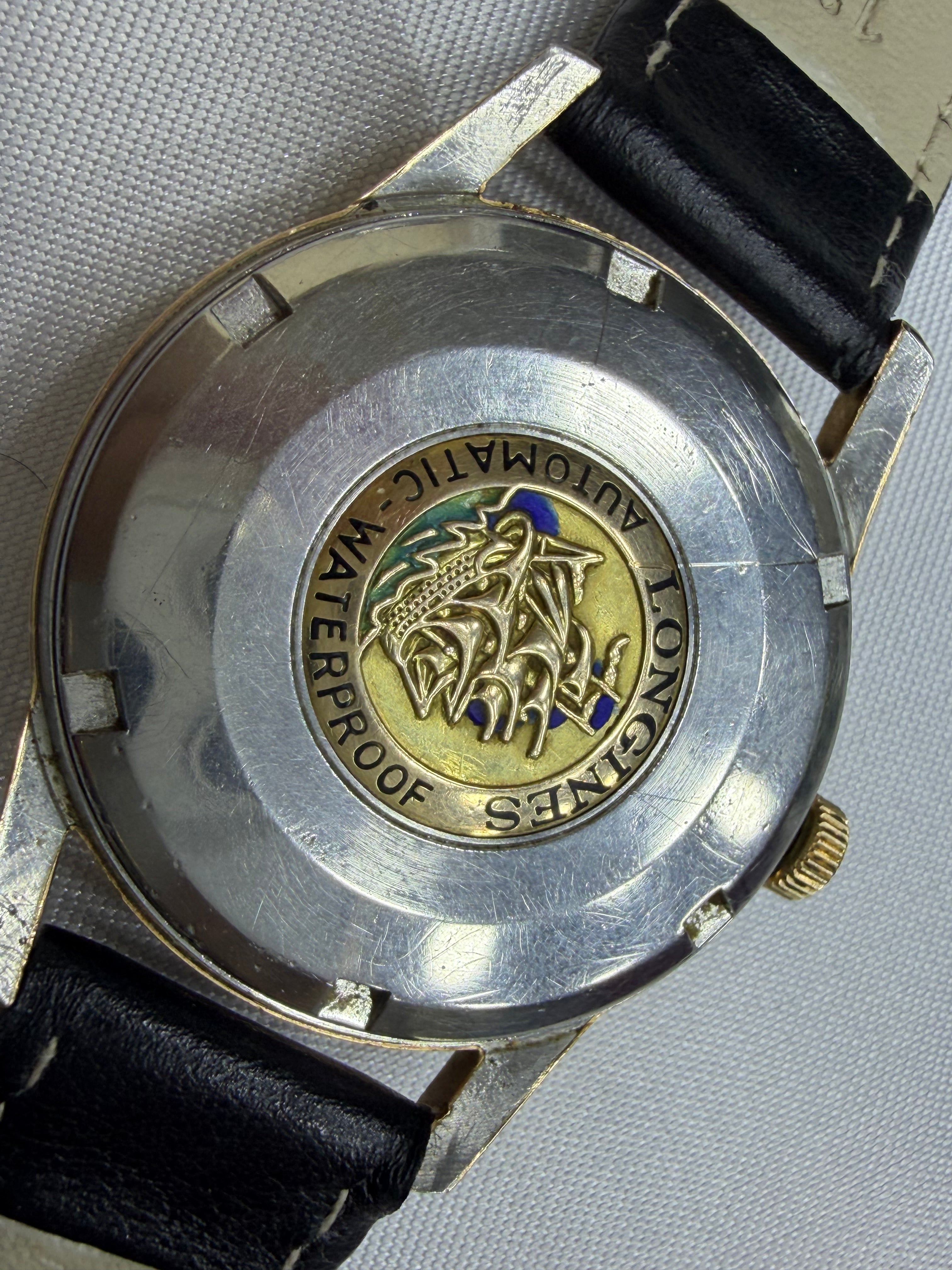 Vintage Longines Flagship Automatic Cream Dial - Date at 12 o'clock with Gold Caravelle Ship Medallion